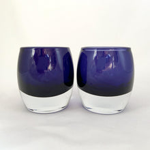 Load image into Gallery viewer, Add some ambiance to spa time or a special occasion with this pair of striking hand blown glass votive candle holders with clear bottoms and an cobalt blue body. They are gorgeous!  In excellent vintage condition, free from chips.  Measures 3 x 3 1/4 inches
