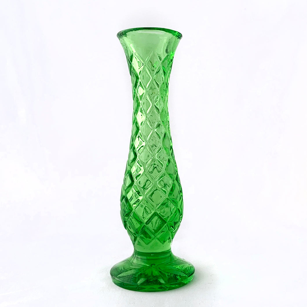 Pretty vintage green pressed glass footed bud vase with diamond pattern and star on the bottom. Maker unknown.  In excellent condition, free from chips/cracks.  Measures 2 1/4 x 6 1/2 inches