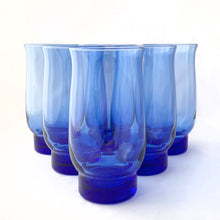 Load image into Gallery viewer, Vintage set of six dusky blue &quot;Tulip&quot; iced tea glasses. Produced by the Libbey Glass Company, circa 1974. And their stackable!  In excellent condition, free from chips/cracks.  Measures 3&quot; x 6&quot;, holds 16oz
