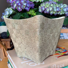 Load image into Gallery viewer, RARE FIND! Absolutely stunning vintage mid-century atomic style jardiniere planter from the &quot;Elegance&quot; line. This planter is square with the corners pulled upward and decorated in a basketweave pattern finished with the Golden Beige glaze which appears as a gold base with silver splatter. Produced by Shawnee Pottery, USA, circa 1960s. A gorgeous collector&#39;s piece!  In excellent condition, free from chips/cracks/repairs.  7 1/8 x 7 1/8 x 6 1/4 inches
