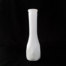 Load image into Gallery viewer, Vintage white milk glass floral bud vase with a elongated hexagon paneled pattern. Produced by the E.O. Brody Glass Company, circa 1960s. This elegant vase is perfect for wedding, bridal arrangements and suits any decor style.

In excellent condition, no chips/cracks.

Measures 2 5/8 x 8 1/2 inches
