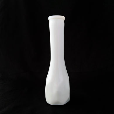 Vintage white milk glass floral bud vase with a elongated hexagon paneled pattern. Produced by the E.O. Brody Glass Company, circa 1960s. This elegant vase is perfect for wedding, bridal arrangements and suits any decor style.

In excellent condition, no chips/cracks.

Measures 2 5/8 x 8 1/2 inches