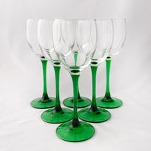 Load image into Gallery viewer, Elegant vintage mod Luminarc emerald green stem/foot with clear blown glass bowl wine goblets, set of six. Produced in France by Cristal d&#39;Arques between 1996 - 2008. We are loving the vibrancy of the stems that will add the perfect pop of colour to any tablescape. Cheers!  In excellent condition free from chips/cracks. Unmarked.  Each glass measures 2 3/4 x 7 5/8 inches
