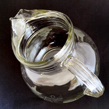 Load image into Gallery viewer, This vintage &quot;Ribbed Clear&quot; Ice Lip Roly Poly Ball Pitcher etched with grapevines is a total showstopper! Its classic ribbed sides, collar, and ice lip will take your parties to the next level. Produced by Anchor Hocking, USA, circa 1960s.  In excellent  condition, with no chips or cracks.  The pitcher measures 6&quot; tall
