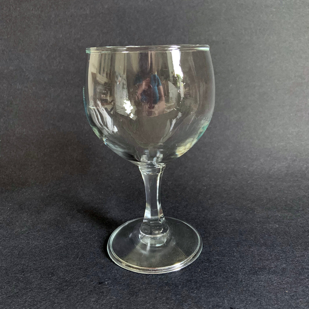 A vintage set of six elegant faceted stemmed clear wine glasses. Cheers!  All are in excellent  condition with no scratches, chips, or cracks. Unmarked.  Each glass measures 3