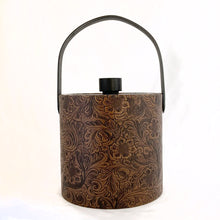 Load image into Gallery viewer, Vintage faux tooled leather ice bucket with floral paisley pattern in brown with black lid and handle. Hammered metal claw tongs included. Produced by Irvinware USA, circa 1970.  In excellent condition, free from wear/damage.  Measures 7-3/4&quot; x 8-1/2
