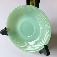 Load image into Gallery viewer, Highly collectible vintage Fire-King &quot;Jane Ray&quot; pressed glass jadeite cup and saucer. Produced by the Anchor Hocking Glass Company, USA, between 1940 - 1970. In excellent condition, free from chips/cracks/repairs. Maker&#39;s mark present on the bottom of each piece, see photos. The cup measures 2-3/8&quot; x 1-3/4&quot; and the saucer measures 4-1/8&quot;.
