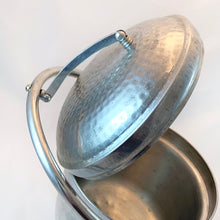 Load image into Gallery viewer, Vintage hammered aluminium ice bucket with self lifting handle on the lid. Marked Made in Italy.  In great vintage condition.  Measures 6 1/4 x 7 1/2 inches
