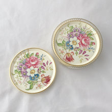 Load image into Gallery viewer, Pretty set of six melmac coasters decorated in a colourful spring flowers design with a clear plastic holder. Crafted by Asian, India, circa 1980.  In excellent vintage condition.  4 inch diameter   
