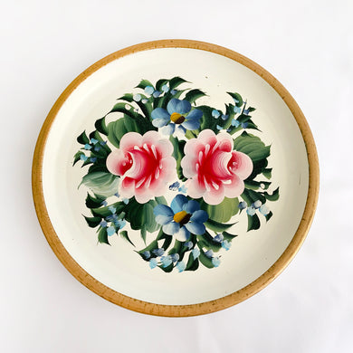 It's such a wonderful feeling when we stumble on such a lovely hand painted piece like this vintage metal tray. The florals are artfully painted in shades of pink and blue on a cream background with a gold rim. Great to use on a vanity, dresser or as wall art.  The painting is vibrant and in great vintage condition with very little wear.  Measures 12