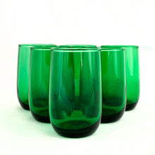 Load image into Gallery viewer, Enjoy a set of six classic vintage &quot;Roly Poly Forest Green&quot; flat juice glasses produced by the Anchor Hocking Glass Co., circa 1970s. Each glass boasts a smooth finish and capacity of 5 ounces. All glasses are in excellent condition, with no chips or cracks. Perfect for any mid-century modern style home.
