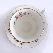 Load image into Gallery viewer, Vintage teacup and saucer in the &quot;Fragrance&quot; pattern. Produced by Paragon Fine Bone China England.  In excellent condition, free from chips/cracks/repairs. Maker&#39;s marks on the bottom with Royal Warrant and &quot;BY APPOINTMENT TO HER MAJESTY THE QUEEN&quot;  Dimensions of cup 2-3/4&quot; x 2-1/2&quot; and saucer 4-5/8&quot;
