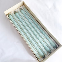 Load image into Gallery viewer, vintage fifteen inch Baroque Slim Twist wax Candles in French Blue with the product code is number 615. The ten candles are in their original box with six in the plastic sleeves. The box notes these as &quot;another PARAGON® creation&quot;. Produced by Victrylite Candle Co. in Oshkosh, Wisconsin USA, circa 1950s/1960s. You&#39;ll find this phrase printed on each side of the box, &quot;light your evenings with loveliness...&quot; and they are spot on. In excellent vintage condition with wicks intact in original box.
