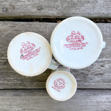 Load image into Gallery viewer, Who doesn&#39;t love ironstone creamers? We love these in the pink transferware &quot;Garland&quot; pattern! Produced by John Maddock &amp; Sons Ltd, England. Circa 1896 for the handled creamers and circa 1960 for the smallest one.  In good used vintage condition. Medium creamer has a tiny chip on the bottom which is not noticeable.  Small measures 2-2-1/2&quot;  Medium measures 2-1/2&quot; 2-7/8&quot;  Large measures 2-3/4&quot; x 3-1/4&quot;
