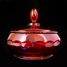 Load image into Gallery viewer, Vintage &quot;Georgian Ruby&quot; lidded pressed glass candy dish. This piece has a honeycomb detail and the lid is topped off with an egg-shaped final. Produced by Viking Glass between 1940 - 1998. Use as intended, or for bath salts/bombs as part of your bath decor. The deep ruby red colour is striking and the foot glows under black light!  In excellent condition, no chips or cracks.  Bowl measures 5-1/8&quot; x 5&quot;
