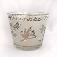 Load image into Gallery viewer, A super cool piece of mid-century history in this hollywood regency style ice bucket with silver birds and botanicals on a frosted band and silver ric rac detail at the rim. Produced by the Libbey Glass Company, USA, circa 1960s.  In excellent condition, no chips, cracks and the silver is in great condition.  Measures 4 3/4 x 5 3/4 inches
