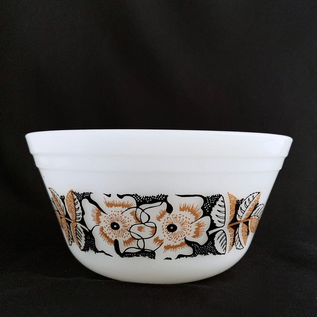 Vintage white milk glass mixing bowl decorated with gold and black flowers and leaves design. Produced by Federal Glass, circa 1960.  In excellent condition, no chips or cracks.  Measures 6