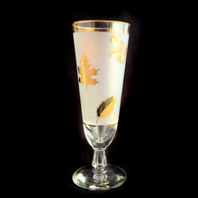 Load image into Gallery viewer, If you&#39;re a fan of the TV series, Mad Men, then you&#39;ll dig these fabulous pilsner or beer glasses in the &quot;Golden Foliage&quot; pattern. Produced by the Libbey Glass Company, circa 1960/70. Covered in gold leaves inside a frosted band surrounded by gold bands, they&#39;d make a fabulous addition to your barware and will definitely amp up the glam of any bar cart.  In excellent vintage condition, no chips or cracks.   Measures 3&quot; x 8-1/8&quot;
