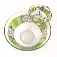 Load image into Gallery viewer, Fantastic vintage chip and dip set printed on the outside with green blocks with gold plumes. Perfect for your next party, movie night, game night or get-together. There is no obvious wear on the glass. The small bowl fits nicely in the brass coloured metal bracket which secures it onto the large bowl. Produced by the Culver Glass.  The glass is in excellent over condition, no chips or cracks. There is some paint fade on the larger bowl  Size: large bowl 10-1/2&quot; inches x 6&quot; | small bowl 5&quot; x 2.25&quot; 
