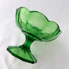 Load image into Gallery viewer, A vibrant emerald green footed compote or candy bowl. It has a beautiful scalloped both atop a 10-sided footed pedestal. Perfect to serve candies or nuts. Easily repurpose as a catchall or vanity/dresser to hold cotton balls, bath bombs or trinkets. It&#39;s such an elegant statement piece and will and drama to any home decor style!  In excellent condition, no chips or cracks. Maker unknown.  Measures 5 3/8 x 3 7/8 inches
