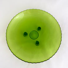 Load image into Gallery viewer, The colour of the green dish is luminous! We believe this dish was hand blown and has a scalloped edge with three peg-like feet. Perfect as a trinket dish, or to serve chocolates or candies.  In excellent condition, no chips or cracks.  Measures 7 x 1 inches

