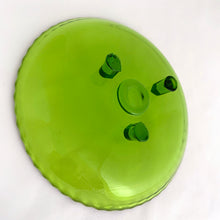 Load image into Gallery viewer, The colour of the green dish is luminous! We believe this dish was hand blown and has a scalloped edge with three peg-like feet. Perfect as a trinket dish, or to serve chocolates or candies.  In excellent condition, no chips or cracks.  Measures 7 x 1 inches
