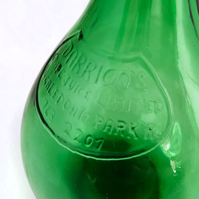 Vintage mold blown green glass demijohn. Impressed into the glass is 