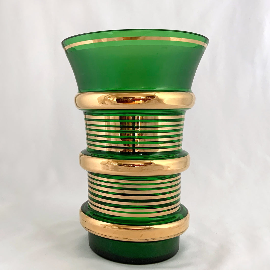 Stunning boho style glass vase in forest green with brilliant gold stripes and protruding ribs finishing in a trumpet shape. Likely produced in Czechoslovakia, maker unknown.  In excellent condition, no chips or cracks.  Measures 5 3/4 x 8 1/4 inches
