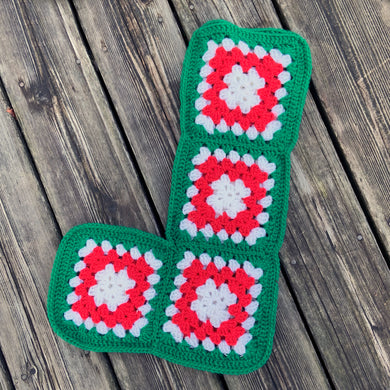 Sweet vintage handmade crocheted granny squares Christmas stocking with red and white squares banded with green. Such a lovely piece to hang on your mantle and fill with treats.  In excellent condition.  Measures approximately 13-1/2