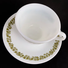 Load image into Gallery viewer, Vintage cup and saucer in the green &quot;Spring Blossom&quot; pattern on white glass. Microwave safe. Produced by Corning USA, circa 1970.  In excellent condition, free from chips/cracks/wear.  Cup measures 3-3/4&quot; x 2-3/4&quot; and the saucer measures 6-3/16&quot;
