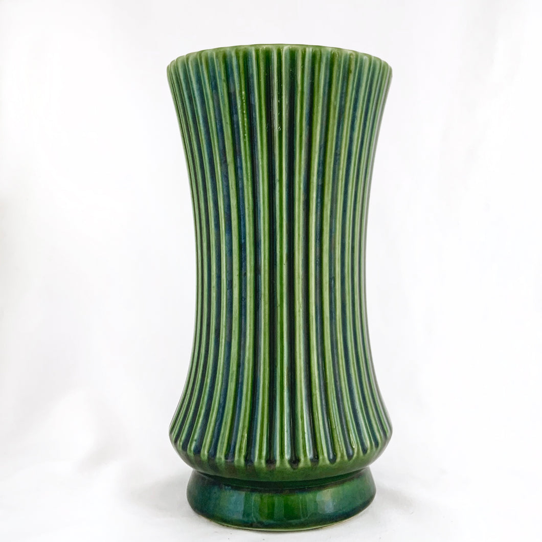 Large sized vintage green ribbed art pottery art deco style vase. Produced by UPCO, circa 1950. In excellent condition, no chips or cracks. Marked on the bottom. Measures 5 x 10 inches