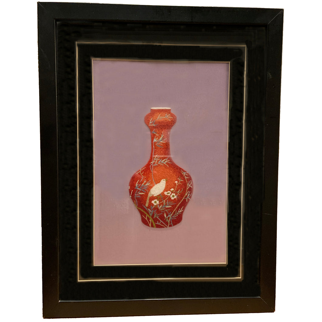 From a distance, one would think this burnt orange vase is a painting, however, it's actually a stunning hand embroidered silk thread on fine Chinese mauve silk depicting a botanical scene with bird and flowers. It's an absolute masterpiece!  In excellent condition.  Image measures 7 1/2 x 11 1/4, frame measures 13 1/8 x 17 inches