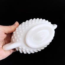 Load image into Gallery viewer, Vintage white milk glass is the epitome of simple elegance! This pretty piece is a handled nut dish in the &quot;Hobnail&quot; pattern. Produced by Fenton, post 1970. Marked on the bottom. In excellent condition, free from chips or cracks.  Measures 6-3/4&quot; x 3-1/2&quot; x 2-1/2&quot;
