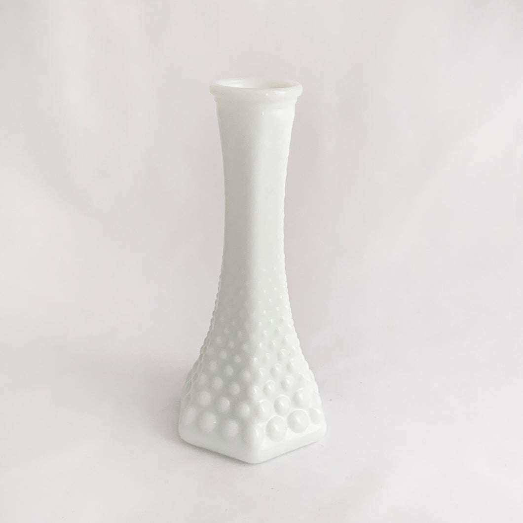 A very popular piece, this vintage hobnail patterned six sided milk glass bud vase was made by the E.O. Brody Company, USA, 1960s. Any flower arrangement will look beautiful in this simple and elegant white vase. A perfect addition to your vintage, farmhouse or wedding decor.  In excellent condition, no chips or cracks.  Measures 6 inches   