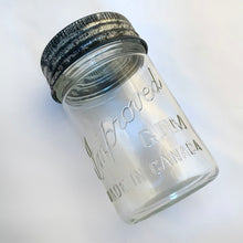 Load image into Gallery viewer, Vintage 1 pint clear glass Improved GEM mason jar with glass starburst lid and zinc ring closure.  In good vintage condition. Made in Canada.  Measures 3 x 6 1/2 inches  Measures 1 pint
