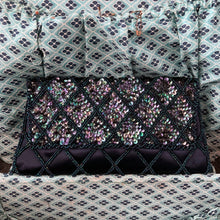 Load image into Gallery viewer, Gorgeous handmade mid-century vintage evening clutch bag covered in a diamond pattern of indigo blue seed beads and iridescent blue sequins with silver toned metal push button closure. The interior is lined with indigo coloured satin with a small pocket. The bag is large enough for a cell phone, credit cards/cash. Produced by Du-Val in Japan. An absolutely stunning piece that would make an incredible accessory. In overall excellent condition. Looks brand new
