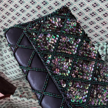 Load image into Gallery viewer, Gorgeous handmade mid-century vintage evening clutch bag covered in a diamond pattern of indigo blue seed beads and iridescent blue sequins with silver toned metal push button closure. The interior is lined with indigo coloured satin with a small pocket. The bag is large enough for a cell phone, credit cards/cash. Produced by Du-Val in Japan. An absolutely stunning piece that would make an incredible accessory. In overall excellent condition. Looks brand new
