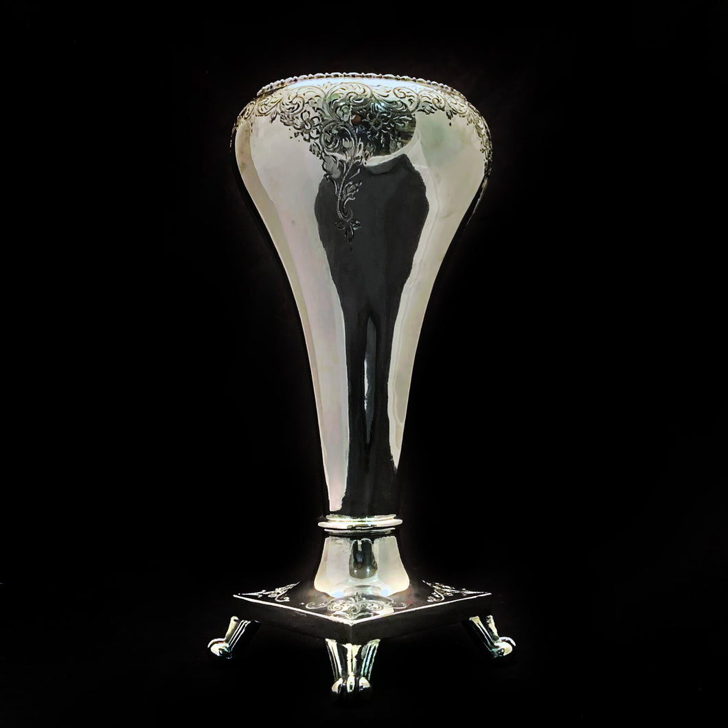 Gorgeous silver plated inverted teardrop footed vase with lovely engraved details and beaded edge. This piece is absolutely gorgeous and will look even more so with a beautiful floral arrangement. A superb decor accessory!  Maker's marks on the bottom are difficult to decifer. Made in England.  In great vintage condition and all shined up.  Measures 3-3/4 x 8-1/4 inches