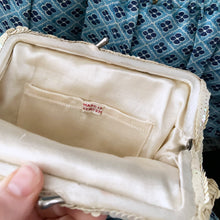 Load image into Gallery viewer, Gorgeous handmade mid-century vintage evening clutch bag covered in a  iridescent cream sequins with matching finger strap and kiss closure. The interior is lined with cream coloured satin with a small pocket. The bag is large enough for a cell phone, credit cards/cash. Made in Belgium. An absolutely stunning piece that would make an incredible accessory. In overall excellent condition.
