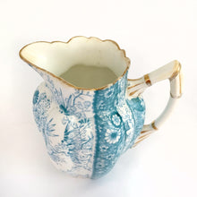 Load image into Gallery viewer, We are thrilled to offer from our personal collection this rare and beautiful RARE antique daisy-shaped bone china creamer pitcher in the complex floral &quot;Jungle Print&quot; pattern in turquoise. Produced by JF Wileman, the precursor to Foley and Shelley in England, circa 1889.   In good condition for age. Several small chips at the rim. No cracks or crazing. Wileman backstamp with registration marks &quot;117220&quot; and &quot;115540&quot; with &quot;6088&quot; in gold denoting the pattern name.  Measures 2-1/4&quot; x 3-1/4&quot;
