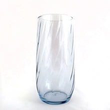 Load image into Gallery viewer, We are digging the swirl optic and pale blue colour of these tall glasses. The pattern is &quot;LRS250 Blue&quot; pattern, set of eight (8). Produced by the Libbey Glass Company, circa 1970. Your bar cart will thank you.....cheers!  In excellent condition, no chips or cracks.  Each glass measures approximately 2-3/4&quot; x 5-3/4&quot;
