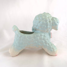 Load image into Gallery viewer, Adorable mid-century hand painted ceramic anthropomorphic happy lamb planter in blue, pink and yellow. Produced by Rubens Originals of Japan, circa 1950. The epitome of kitschy home decor and a great little vessel for a houseplant, succulent or repurpose to hold baby care items or created a pretty Easter display filled with mini eggs!  In excellent condition, no chips, cracks or repairs. Original sticker.  Measures 5 3/4 x 5 1/2 inches
