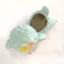 Load image into Gallery viewer, Adorable mid-century hand painted ceramic anthropomorphic happy lamb planter in blue, pink and yellow. Produced by Rubens Originals of Japan, circa 1950. The epitome of kitschy home decor and a great little vessel for a houseplant, succulent or repurpose to hold baby care items or created a pretty Easter display filled with mini eggs!  In excellent condition, no chips, cracks or repairs. Original sticker.  Measures 5 3/4 x 5 1/2 inches
