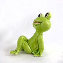 Load image into Gallery viewer, Adorable vintage mid-century ceramic figurine of a smiling, cross-legged lounging lime green frog. Produced by Noritake of Japan for Gift Craft Toronto, circa 1970s. A great decor piece...it&#39;s just such a happy and fun piece!  In excellent  condition free from chips/cracks/repairs.  Measures 3 1/4 inches tall
