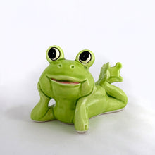 Load image into Gallery viewer, Adorable vintage mid-century ceramic figurine of a smiling, resting lime green frog. Produced by Noritake of Japan for Gift Craft Toronto, circa 1970s. A great decor piece...it&#39;s just such a happy and fun piece!  In excellent  condition free from chips/cracks/repairs.  Measures 3 1/2 x 2 3/4 inches tall

