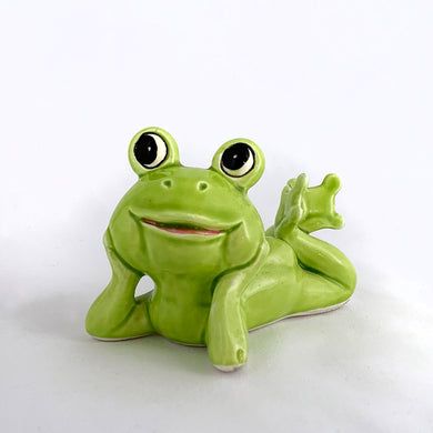Adorable vintage mid-century ceramic figurine of a smiling, resting lime green frog. Produced by Noritake of Japan for Gift Craft Toronto, circa 1970s. A great decor piece...it's just such a happy and fun piece!  In excellent  condition free from chips/cracks/repairs.  Measures 3 1/2 x 2 3/4 inches tall
