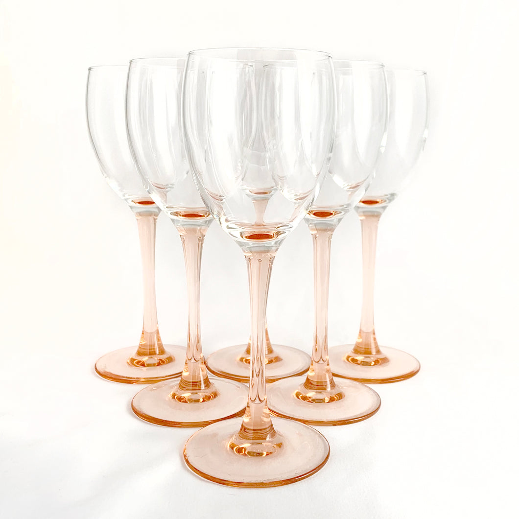 Delightful pink stemmed claret wine glasses in the 