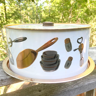 Keep your cakes, cookies and baked goods safe in this super kitschy mid-century vintage metal domed cake keeper with copper and black housewares graphics. Produced by Weibro Chicago USA, circa 1950.  In good vintage condition with minor wear.  Measures 11 3/4 x 4 1/2 inches