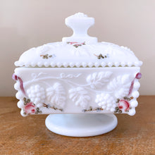 Load image into Gallery viewer, Beautifully hand painted vintage pressed milk glass lidded box in the highly detailed &quot;Beaded Grape&quot; pattern with pink, green and blue florals. Produced by the Westmoreland Glass Company, between 1940-1984.  In excellent condition, free from chips/cracks. Paint is vibrant.  Measures 4-1/2&quot; x 5&quot;
