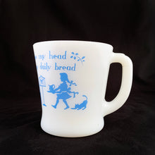 Load image into Gallery viewer, Vintage Fire-King milk glass D-handled mug printed in blue with seated children saying mealtime prayer while their mom serves them with puppy and bird observing. The prayer reads, &quot;I fold my hands and bow my head To thank Thee for my daily bread&quot;. Produced by Anchor Hocking Glass Co., USA.  In excellent  condition, no chips or  cracks.  Measures 3 1/4 x 3 3/8 inches
